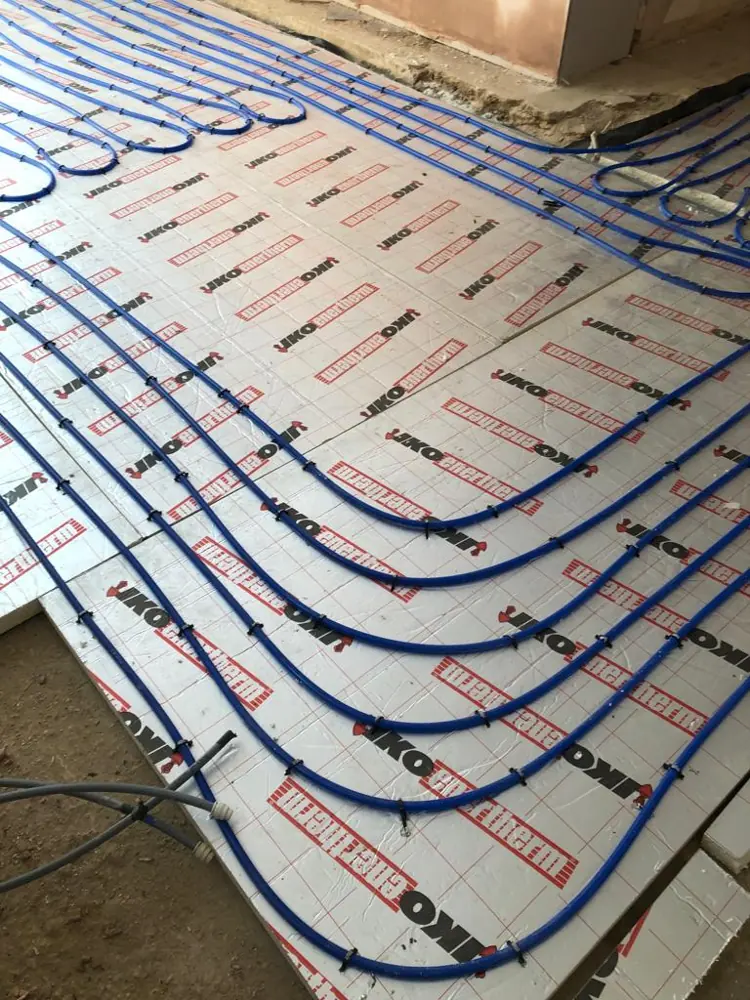 Underfloor heating pipes laid on insulation boards