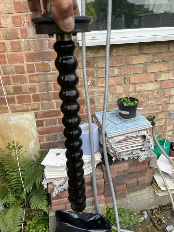 Drain rods used to clear a blocked outside drain