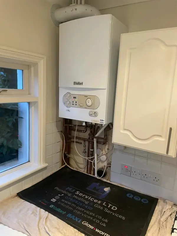 Vaillant boiler fitted beside a kitchen window