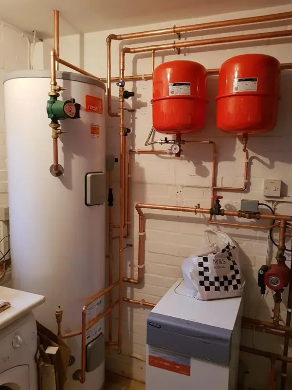 Heating system pipework with pumps and expansion vessels