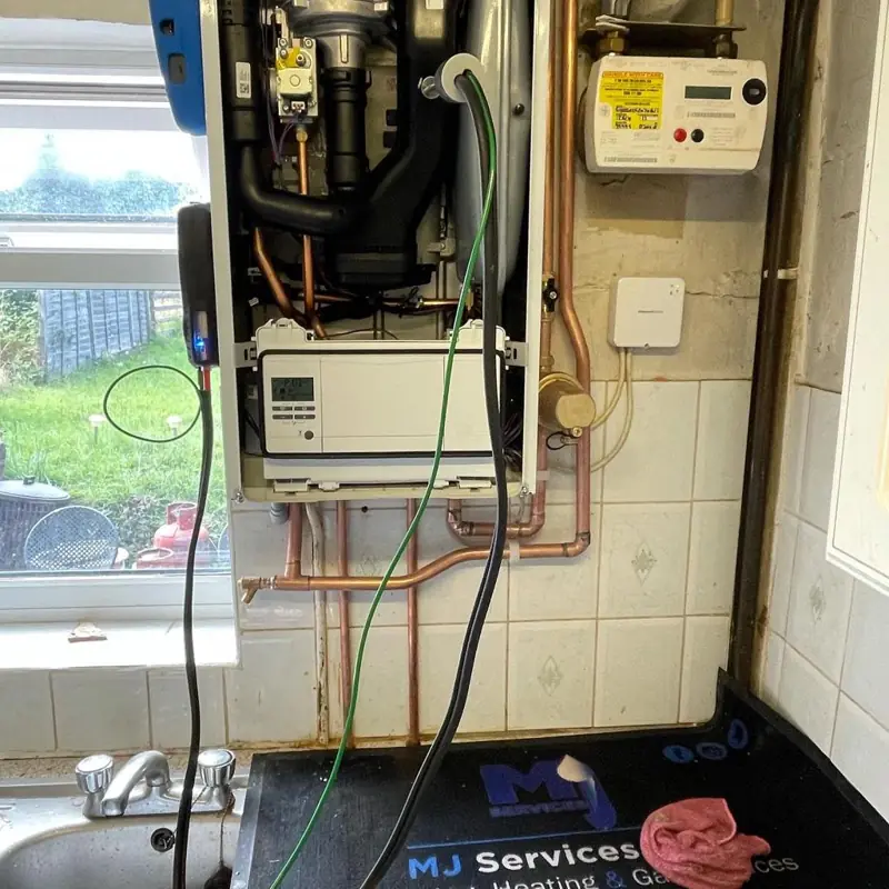 Boiler opened up beside the gas meter during a repair