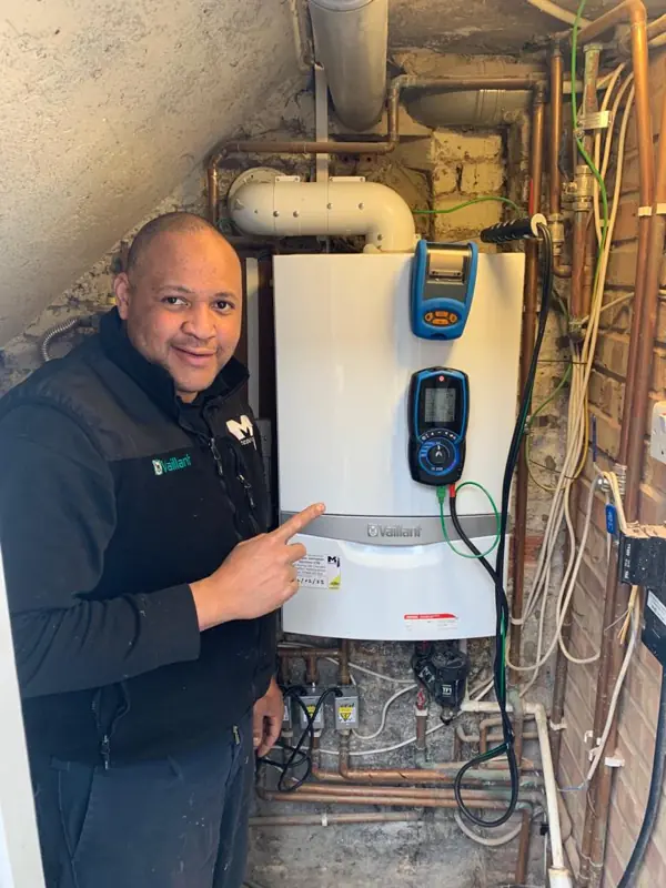 Selvin checking a boiler with a flue gas analyser