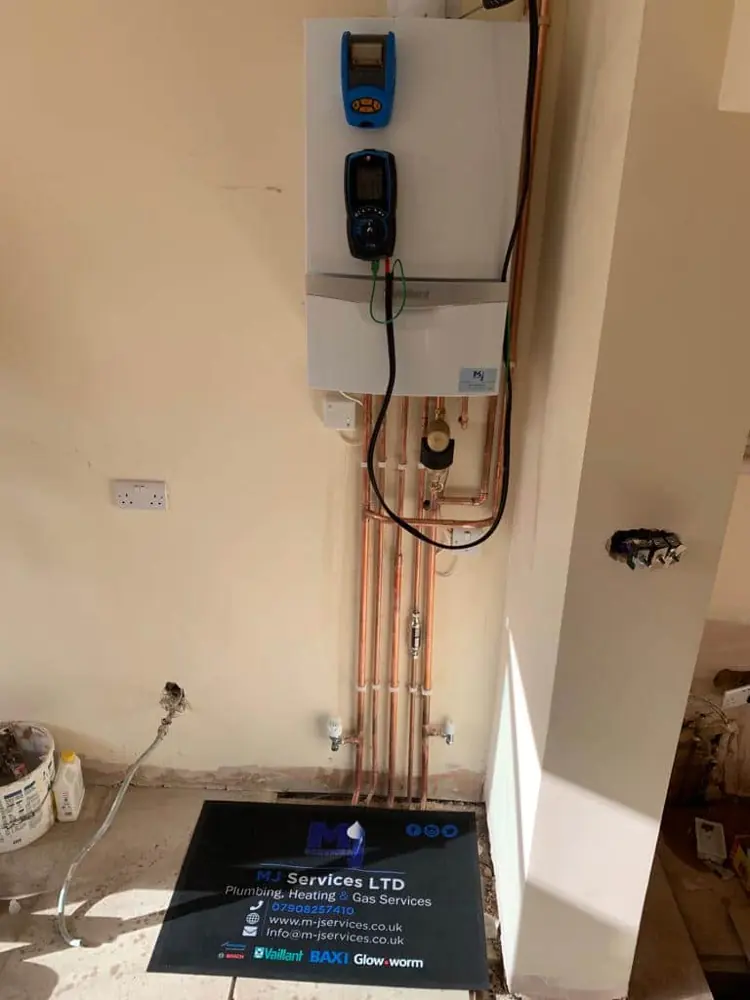 Gas boiler and pipework checked during a gas safety inspection