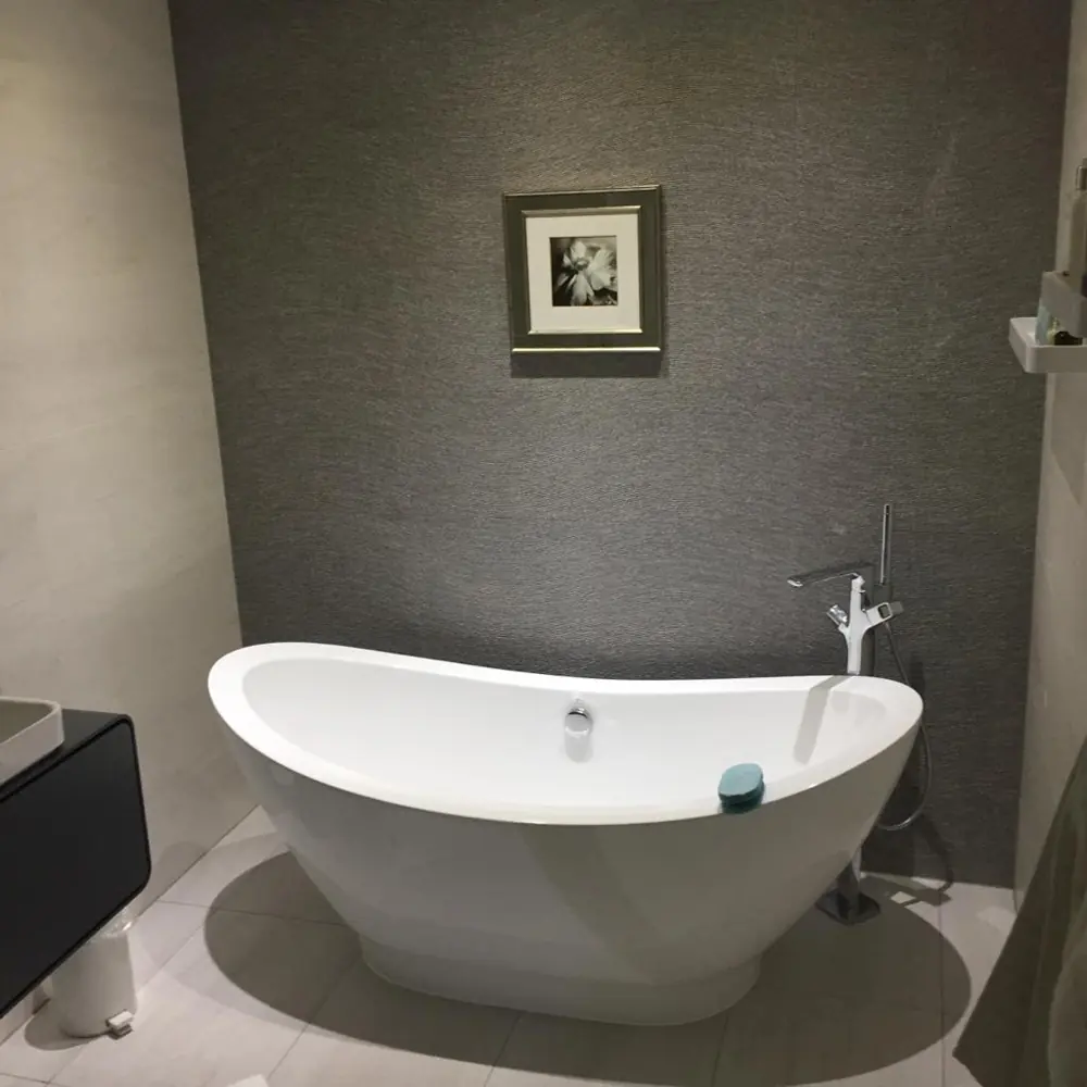 Freestanding roll top bath in a grey bathroom