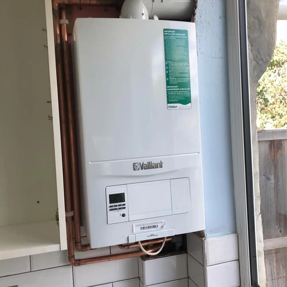 Vaillant combi boiler fitted in a kitchen cupboard