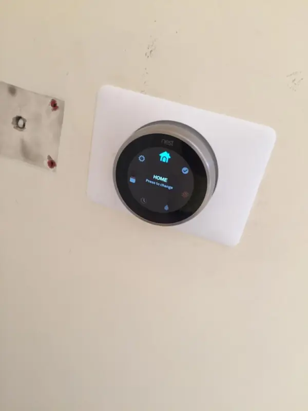 Smart thermostat showing the home screen